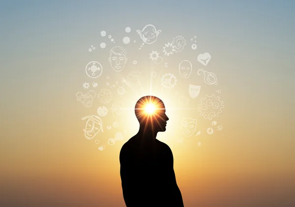 Figure illuminated by insight, symbolizing self-awareness.